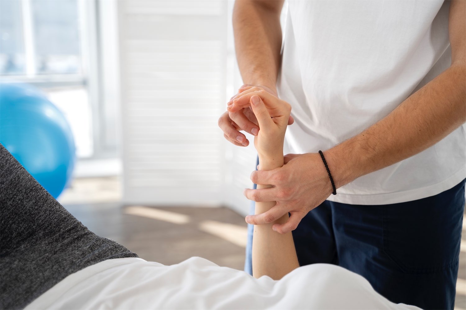 Sports massage in Chorley Sports massage therapist treating a patient's calf muscle at NV Physiotherapy clinic in Chorley